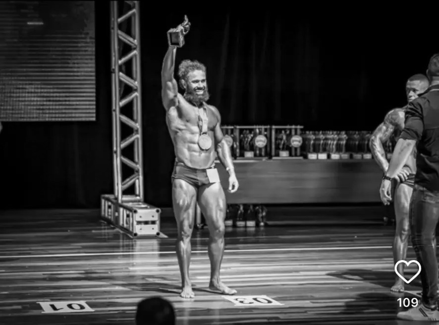 Joab Pereira celebrating a competition win on stage